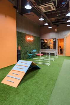 an indoor play area with artificial grass