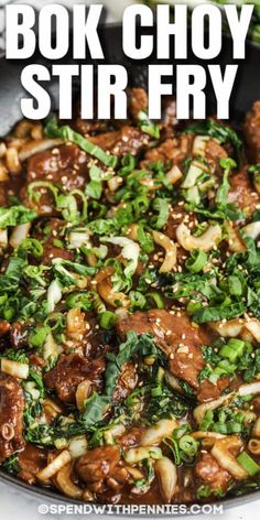 a skillet filled with stir fry meat and vegetables on top of a white table