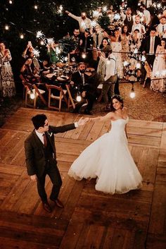 a bride and groom dancing on the dance floor