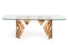 a glass table topped with lots of gold coins on it's legs and bottom