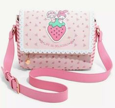 Spruce up your look with sweet Sanrio style! This pastel pink crossbody features My Melody and My Sweet Piano atop a strawberry, just above embroidered "Life is Delicious" lettering. With a strawberry zipper pull, pink stitching, and magnetic closure, this bag keeps your valuables safe and chic! Polyurethane; polyester Approx. 10 1/2" W x 8" H x 5 1/2" D Sanrio Style, My Sweet Piano, Dr Wardrobe, Kawaii Bags, Sanrio My Melody, Box Lunch, Kawaii Accessories, Printed Handbags, Cute Backpacks