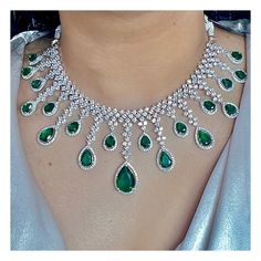 Gorgeous fine quality replica diamond and emerald green studded necklace with a white  rhodium plating and matching Earrings Item contains: Necklace and earrings AAA-quality cubic zirconia was used. Highest quality and craftsmanship Necklace Fitting is adjustable Earrings Closure: Pushback Necklace Closure: chain with Hook Cubic Zirconia Emerald Necklace For Wedding, Green Gemstone Diamond Necklace For Wedding, Green Diamond Necklace With Gemstones For Wedding, Green Diamond Jewelry Sets With Jewels, Green Diamond Bridal Necklace With Jewels, Hand-set White Gold Emerald Necklace For Wedding, White Gold Hand Set Emerald Necklace For Wedding, White Gold Emerald Diamond Necklace For Wedding, Exquisite Green Cubic Zirconia Diamond Necklace