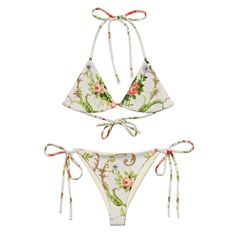 Stay comfortable and stylish all summer with this All-Over Print Recycled String Bikini set. It's made from soft recycled polyester with double-layering and UPF 50+. Style the straps how you like and get ready to swim!  * Soft and stretchy material with UPF 50+ * Sizes up to 6XL * Bikini top comes with removable padding for comfort * Multiple ways to tie and style the bikini set Disclaimers:  * Due to the 2-layered construction and internal stitching, a visible stitch may appear in the crotch seam of the bikini bottom. This is a normal part of the manufacturing process and does not impact the quality or performance of the product. * To make your All-Over Print Recycled String Bikini last longer, thoroughly rinse it off after each use and get rid of any chlorine/salt residue. Boho Swimwear, Retro Floral, Stretchy Material, Resort Wear, String Bikinis, Women Swimsuits, Bathing Suits, Floral Prints, Bathing Beauties