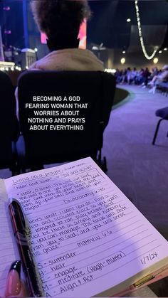 a notepad with writing on it sitting in front of a person's head