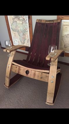 a wooden chair with two wine glasses sitting on it's legs and the seat is made out of wood