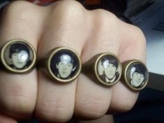 three finger rings with pictures of elvis presley on them