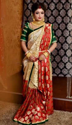 a woman in a red and green sari