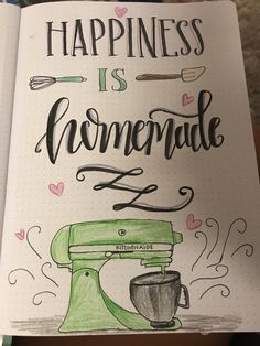 a notebook with the words happiness is homemade written in black ink on top of it