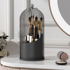 PRICES MAY VARY. Sliding Door: Makeup brush holder with lid is enclosed, so no more dust particles and bacteria landing on makeup brushes, sliding to close rather than lifting a cover from up above 360 Degrees Rotating Base: Make up brush holder organizer spins, so you can access all the items easily, the cover can stay on when brushes are removed or added 3 Different Sections: With different depths slots, makeup brush storage allows short or tall makeup brushes and small cosmetic tools to be st Modern Vanity Table, Makeup Stand, Makeup Display, Makeup Area, Brush Storage, Makeup Brush Organization, Makeup Brush Storage, Makeup Brush Holder, Vanity Organization