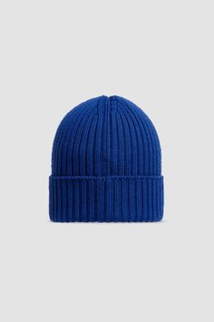 A mid-weight knit, this beanie provides warmth during daily walks and outdoor playtime. The woolen accessory is embellished with a logo patch. Classic Blue Winter Hat, Winter Blue Ribbed Hat, Blue Ribbed Winter Hat, Casual Blue Ribbed Beanie, Blue Beanie For Winter, Outdoor Blue Knitted Beanie, Blue Wool Beanie, Blue Wool Knitted Beanie, Blue Knit Beanie Cap