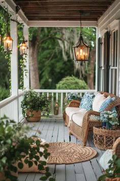 a porch with wicker furniture and hanging lanterns