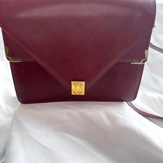 Gorgeous Vintage Must De Cartier Shoulder Bag. Red Burgundy Color. Latch Lock With Cartier Logo. Interior Zipper Pocket. In Fine Condition. Size - 9.5” W X 8” H X 2” D Made In Italy. $525 Or Best Offer. Evening Burgundy Satchel With Gold-tone Hardware, Evening Satchel With Detachable Strap In Burgundy, Evening Burgundy Satchel With Detachable Strap, Chic Burgundy Satchel For Formal Occasions, Evening Shoulder Bag With Detachable Strap In Burgundy, Burgundy Shoulder Bag With Detachable Strap For Evening, Designer Burgundy Bags For Formal Occasions, Elegant Red Satchel For Formal Occasions, Evening Burgundy Shoulder Bag With Detachable Strap