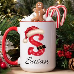 a christmas mug with two gingerbreads in it