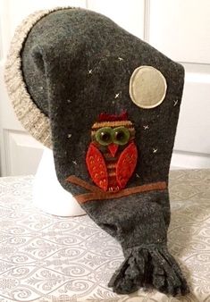 an owl hat is sitting on top of a table