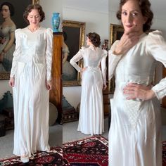 a woman in a white dress standing next to a mirror