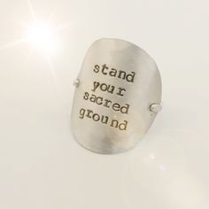 "Live in authenticity. Don't shrink. Don't puff up. Just stand your sacred ground. A sweet reminder on this 1\" sterling silver disc molded to hug your finger. Trendy and classic all at once , this modern \"post-it note\" on your hand will help keep you grounded. Made entirely of sterling silver. (also available in all 14k gold filled) Will arrive to you sweetly packaged, as always. Thank you for peeking in." Hug You, Post It Notes, Hand Stamped, Gold Filled, Statement Rings, Silver Rings, Stamp, Sterling Silver, Silver