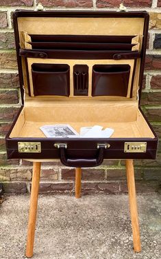 "Vintage briefcase from (I believe) the 1970s. Dark brown leather. Hard shell casing. Has number combination lock. Comes with original paperwork. Never been used. Absolutely beautiful briefcase in mint condition.  Measures 17 3/4\" x 13\" x 4\" plus handle.  Returns not accepted for vintage items. Please message me with any product questions." Luxury Vintage Brown Briefcase For Everyday Use, Luxury Vintage Brown Briefcase For Business, Luxury Vintage Soft Leather Briefcase, Vintage Luxury Briefcase For Office, Luxury Vintage Briefcase For Business, Luxury Vintage Business Briefcase, Luxury Retro Bag With Rectangular Case, Luxury Vintage Cases For Business Trips, Luxury Brown Workwear Cases