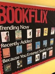 a bulletin board with books on it in front of a yellow wall that says bookflix