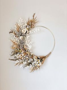 a dried wreath hanging on the wall