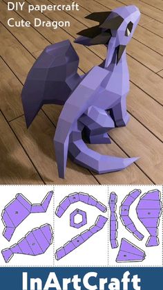 papercraft cut out dragon sitting on top of a wooden floor with text overlay