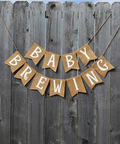 a baby's brewing banner hanging on a fence