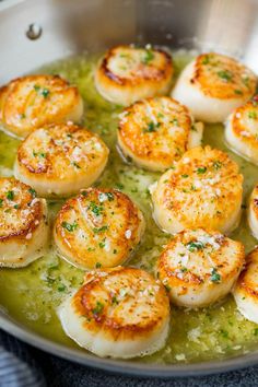 some scallops are cooking in a pan on the stove