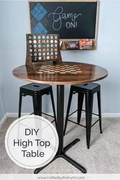 a table with two stools and a board game on it