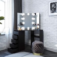 a white brick wall with a vanity and stool in front of it that has lights on