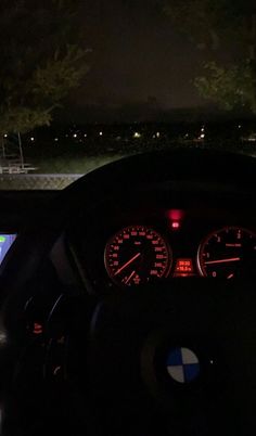 the dashboard of a car at night time