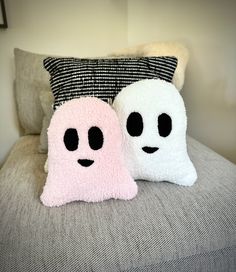 two pillows that have been made to look like ghost faces