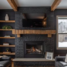 a living room filled with furniture and a fire place