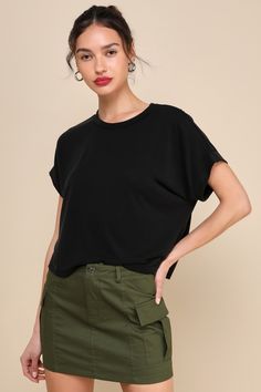 You'll be looking calm and collected all day long in the Lulus Cool Instincts Black Short Sleeve Top! Sleek and stretchy jersey knit shapes this classic tee that has a crew neckline and short, dolman-style sleeves. The relaxed, wide-cut bodice falls to a slightly cropped hem, perfect for pairing with your favorite high-waisted denim. Fit: This garment fits true to size. Length: Size medium measures 19.75" from shoulder to hem. Bust: Great for any cup size. Waist: Not Fitted - comfortable room th Boxy Solid Color Crew Neck Top, Versatile Top With Ribbed Crew Neck, Boxy Crew Neck Top For Layering, Relaxed Fit Solid Color Crew Neck Knit Top, Relaxed Fit Crew Neck Knit Top, Solid Color Crew Neck Knit Top With Relaxed Fit, Versatile Relaxed Fit Crew Neck Knit Top, Cut Tshirt, Knit Tees