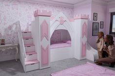 two girls are playing in their princess bedroom