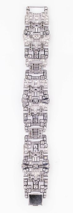 Impressive Art Deco 32 Carat Wide Diamond Platinum Bracelet circa 1920 Silver Baguette Cut Platinum Diamond Bracelet, Platinum Diamond Bracelet With Baguette Cut In Silver, Silver Platinum Diamond Bracelet With Baguette Cut, Art Deco Platinum Diamond Bracelet, Art Deco White Gold Diamond Bracelet, Art Deco Diamond Bracelet With Accents, Art Deco Silver Jewelry With Baguette Diamonds, Silver Art Deco Jewelry With Baguette Diamonds, Art Deco Silver Diamond Bracelet With Brilliant Cut