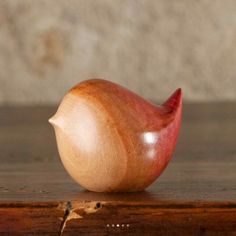 an apple sitting on top of a wooden table