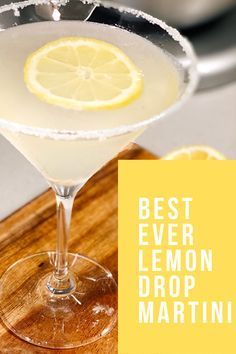 the best ever lemon drop martini is served in a coupe glass on a cutting board