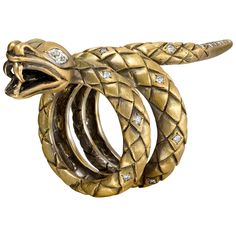 This statement ring was created in New York City by our expert goldsmiths. The design was inspired by Mary Queen of Scots, cousin to Elizabeth I. Elizabeth's advisors referred to Mary as "the bosom serpent" -- close to the queen of England, and dangerous. A bold look comfortable enough to wear every day. 18K yellow gold totaling 30.98 grams, satin finish. Two marquise diamonds totaling 3 points. Accent diamonds totaling 2 points. 2 1/8 in. long. Made in New York City. Queen Of Scots, Marquise Diamond Ring, Chic Rings, Vintage Cocktail Ring, Round Diamond Setting, Diamond Eyes, Family Jewels, Snake Jewelry, White Diamond Ring