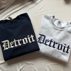 Show your pride every time you wear this Detroit Embroidered Old english sweatshirt.This sweatshirt will keep you comfortable and full of spirit.  Gildan Sweatshirt 8.0 oz., 50/50 pre-shrunk cotton/polyester Reduced pilling and softer air-jet spun yarn 1x1 athletic rib knit collar, cuffs and waistband, with spandex Double-needle stitched cuffs and waistband Fan Apparel Sweatshirt With Embroidered Logo And Crew Neck, Fan Apparel Crew Neck Sweatshirt With Embroidered Logo, Fan Apparel Sweatshirt With Embroidered Logo, Collegiate Sweatshirt With Letter Embroidery For Streetwear, Collegiate Style Sweatshirt With Letter Embroidery For Streetwear, Cotton Sweatshirt With Letter Print For Fans, Collegiate Crew Sweatshirt With Letter Print, School Spirit Crew Sweatshirt With Letter Embroidery, Fan Apparel Cotton Sweatshirt With Embroidered Graphics