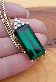 Absolutely Stunning 14k Yellow Gold, Diamond, Natural Green Tourmaline Pendant with a Chain, Necklace. Huge, clean stone , absolutely gorgeous... Perfect Vintage Pre Owned Condition. all sales are final no return  Some pics ENLARGED to see details. ATTENTION BUYERS ALL ITEMS FROM MY SHOP MUST BE PURCHASED STRAIGHT FROM ETSY.com Website only  NOT THRU OFFSITE ADDS Google and Others  All orders purchasing from Google and others will be cancelled Elegant Emerald Cut Tourmaline Jewelry, Elegant Tourmaline Gemstones For Gift, Formal Emerald Cut Tourmaline Jewelry, Elegant Tourmaline Gemstones For Gifting, Elegant Tourmaline Gemstones As Gifts, Formal Hallmarked Tourmaline Jewelry, Formal Yellow Gold Tourmaline Necklaces, Formal Yellow Gold Tourmaline Necklace, Elegant Green Tourmaline Necklaces