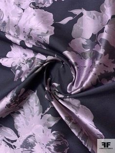 an image of a purple and black floral print fabric