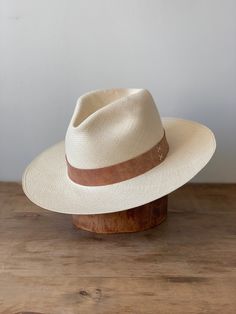 Designed and Styled in Ojai, CA. These beautiful Artisan hats are 100% handmade in Ecuador from sustainably harvested Toquila straw. Size Medium Luxury Natural Panama Hat, Western Style Natural Woven Panama Hat, Woven Toquilla Straw Fedora With Short Brim, Cream Toquilla Straw Hat Bands For Vacation, Handwoven Western Style Sun Hat In Toquilla Straw, Bohemian Natural Panama Hat For Kentucky Derby, Artisan Wide Brim Panama Hat For Vacation, Handmade Wide Brim Fedora In Toquilla Straw, Western Style Wide Brim Panama Hat In Palm Leaf