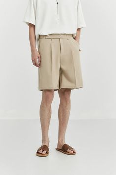 Experience tailored sophistication with our Pleated Tailored Bermuda Shorts, complete with a contemporary belt detail for a touch of edge. Meticulously crafted from a blend of polyester fiber and spandex, these shorts promise comfort and style. The pleated design adds texture, while the tailored fit ensures a sharp silhouette. These Bermudas make a versatile addition to your wardrobe, easily transitioning from casual outings to more formal environments. Pair them with a crisp shirt for a profess Shorts With Belt, Color Care, Professional Look, Bermuda Shorts, Daily Wear, Crop Top, Crop Tops, Blazer, Texture