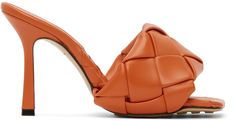 Intrecciato-woven lambskin slip-on sandals in orange. Open square toe. Logo embossed at tonal nappa footbed. Covered stiletto heel. Leather and pebble rubber sole in tan. Approx. 3.75 heel. Supplier color: Paprika Veneta Bottega, Modest Dresses, Heeled Sandals, Stiletto Heel, Luxury Streetwear, Dresses Casual, Bottega Veneta, Slip On Sandal, Heeled Mules