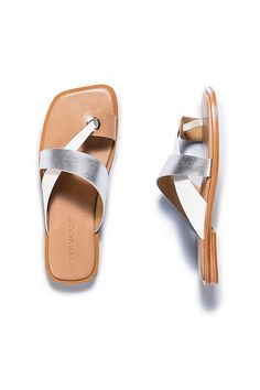 Leather upper, insole Rubber sole Slip-on styling Imported | Amelia Sandals by Bernardo in Silver, Women's, Size: 8.5, Leather/Rubber at Anthropologie Silver Leather Footbed Sandals For Summer, Summer Silver Leather Flats, Summer Silver Sandals With Leather Footbed, Silver Sandals With Textured Footbed, Silver Leather Toe Loop Sandals, Modern Silver Slip-on Sandals, Adjustable Woven Leather Slip-on Sandals, Multicolor Slip-on Sandals With Textured Footbed, Anthropologie