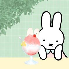 a cartoon bunny sitting next to an ice cream sundae