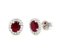 Indulge in luxurious elegance with our 1.13carat ruby and diamond halo stud earrings. Embrace the stunning contrast of the vibrant ruby and dazzling diamonds in a classic halo design. Elevate any outfit with this exquisite touch of sophistication and make a statement that will leave a lasting impression. Metal: 18K White GoldDiamond Weight (32): 0.16ct twRuby Weight (2): 0.97ct twBacking: Push Backs Dimensions: L 8mm X 7mm Classic Red Diamond Earrings With Brilliant Cut, Formal Halo Jewelry With Lab-created Ruby, Luxury Ruby Earrings With Halo Design, Classic Red Halo Design Earrings, Anniversary Ruby Earrings With Halo Setting, Red Halo Setting Earrings For Formal Occasions, Classic Ruby Halo Earrings, Classic Ruby Halo Design Earrings, Classic Ruby Earrings With Halo Design