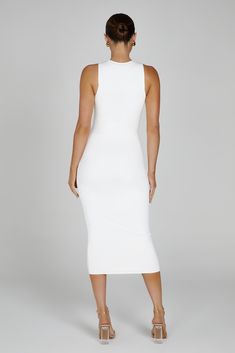 Feminine-power dressing.The JILL is a sleeveless tank midi dress that is tailored from our premium blend of nylon and elastane, giving it a soft and silky feel and minimising discomfort even after extended wear. The double-lining effectively conceals the lines and colours of undergarments, eliminating the need for special undergarments. The midi length strikes a perfect balance between modesty and modernity, while the high round neckline feels casually refined, while the body-hugging fit flatter Feminine Power, Power Dressing, Beige Dresses, Dinner Dress, Basic Dress, White Midi Dress, Crepe Dress, Orange Dress, Linen Dresses