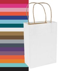 a white paper bag with handles is against a multi - colored background