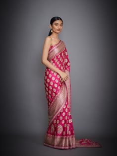 Editor's Note This set features a fuchsia floral/tropical saree with an unstitched blouse. Fabric: Silk Satin Components: Sari and unstitched blouse Care: Dry Clean Only About the DesignerRi Ritu Kumar is one of India’s foremost designers. She has developed a unique style of her own, reflecting the ancient traditions of Indian craftsmanship in a contemporary vocabulary. With a background in art history and museology, which has enriched her horizons, Ritu’s understanding of ancient designs and th Pink Pre-draped Saree With Zari Weaving For Reception, Pink Pre-draped Saree For Reception With Zari Weaving, Pink Blouse With Zari Weaving For Reception, Pink Blouse Piece With Zari Weaving For Reception, Pink Zari Weaving Blouse Piece For Reception, Pink Blouse With Dupatta In Traditional Drape, Pink Self-design Pre-draped Saree For Reception, Pink Chanderi Blouse Piece, Designer Pink Blouse With Zari Weaving