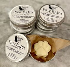 Homemade and All Natural Palm Balm.  Perfect for keeping the paw pads and noses soft and from cracking.  Made with the following 4 ingredients:  -Beeswax -Unrefinded Shea Butter -Coconut Oil -Pure Almond Oil Store in a cool dry space. Safe for pets to lick! How To Make Dog Paw Balm, Diy Dog Paw Balm, Dog Paw Salve, Natural Dog Paw Balm, Diy Spa Gifts, Dog Shampoo Bar, Honey Products